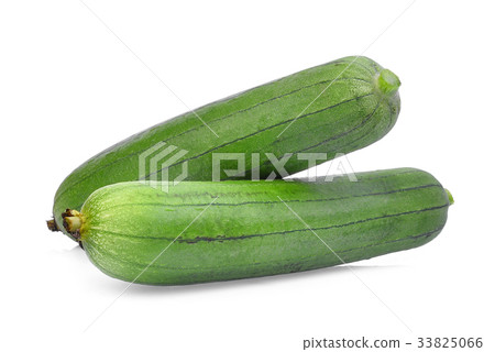 图库照片: two fresh green sponge gourd or luffa isolated