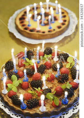 图库照片: two birthday cakes with candles