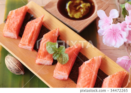 图库照片: crab stick with wasabi sauce and making sushi.