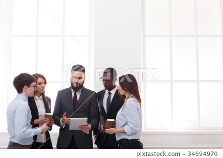 图库照片: corporate meeting of employees with boss in office