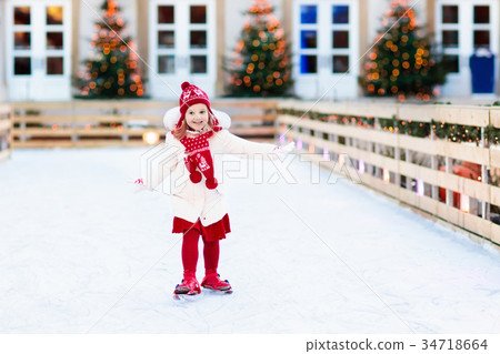 ice skating,sailing 图库照片: kids ice skating in winter. ice skates for child.