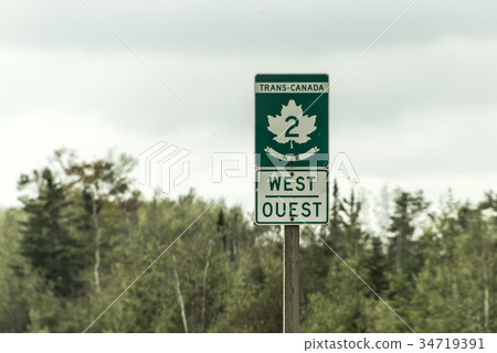 图库照片: signpost with green sign of trans canada 2 highway