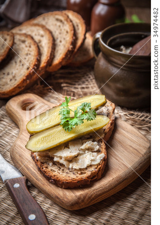 图库照片: a slice of country bread with homemade lard.