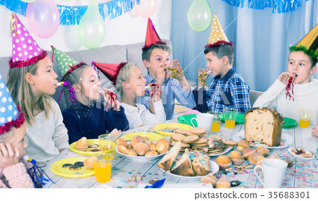 图库照片: positive children having a good time at a birthday