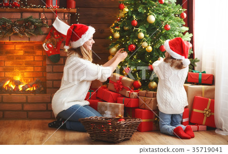 图库照片: happy family mother and child girl decorated christmas