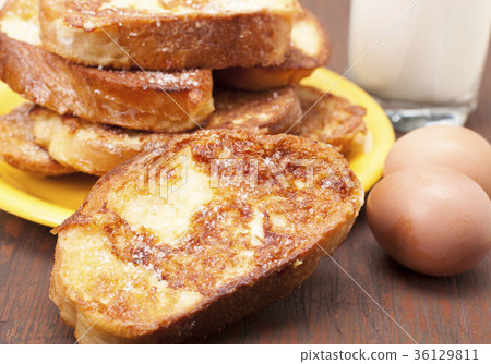 图库照片: toasted white bread with milk and eggs.