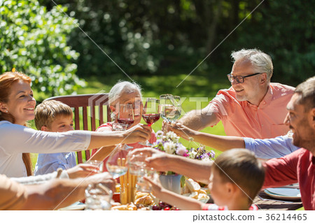family party,home party 图库照片: happy family having dinner or summer garden party