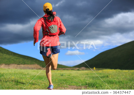 图库照片: young fitness woman trail runner running outside