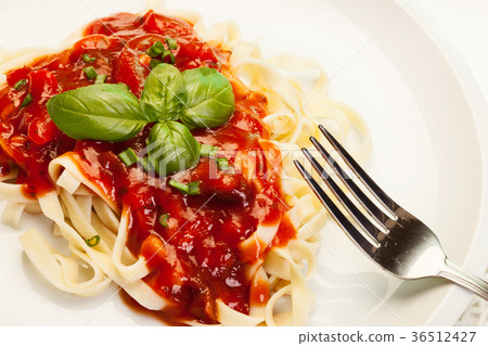 图库照片: pasta fettuccine with tomato sauce and basil