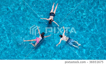 图库照片: people swimming in the hotel pool on summer day