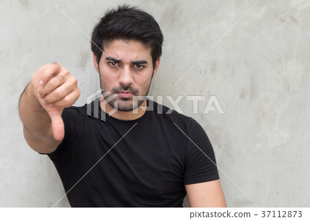 图库照片: man giving rejecting thumb down