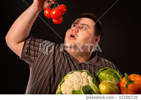 图库照片: diet fat man eating healthy food . healthy