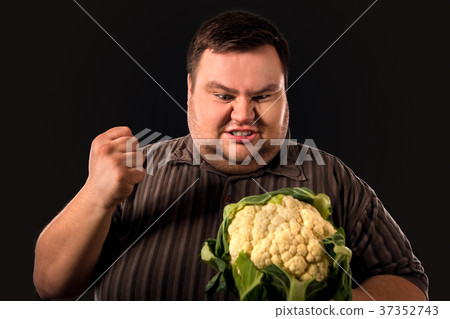 图库照片: diet fat man eating healthy food . low quality