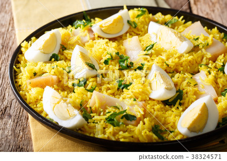 图库照片: kedgeree curry rice with smoked fish, eggs