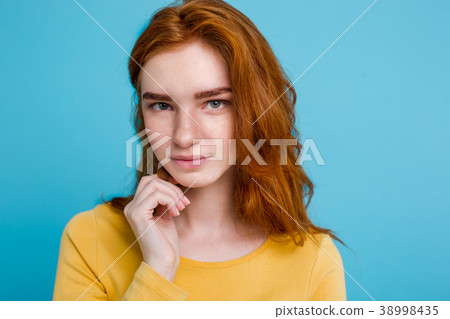 图库照片: headshot portrait of happy ginger red hair girl