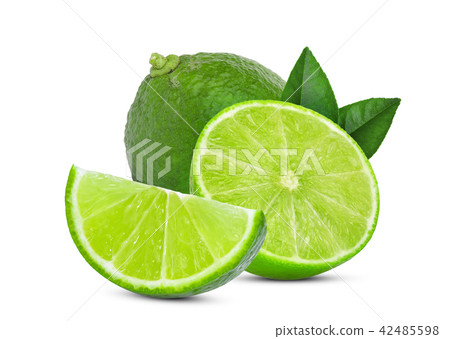 图库照片: whole and slice green lime with green leaves