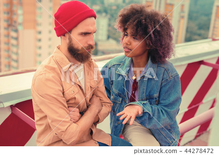 图库照片: serious man feeling offended and frowning while his
