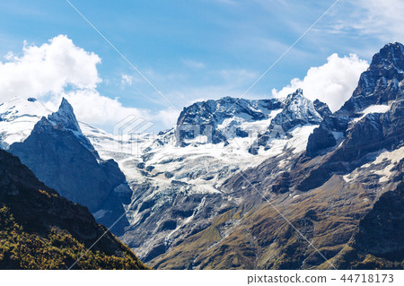 图库照片: snow fields on mountain tops near dombay village