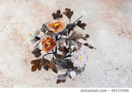 图库照片: vintage glass flowers on concrete background.