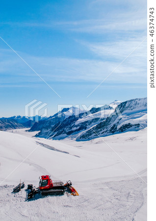 stock photo: snowcat to work on a snow field of jungfraujoch