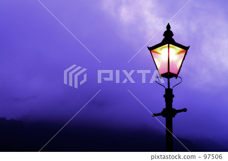 Cloudy mountains and street lights Cloudy mountains and street lights 97506