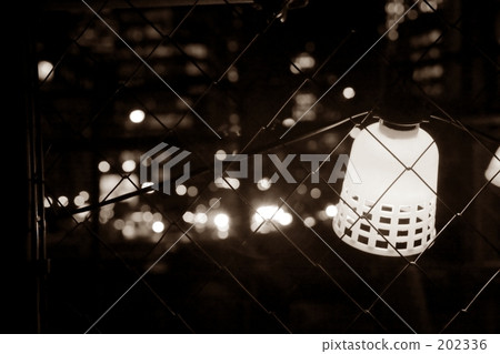 Wire mesh and darkness, the light over there Wire mesh and darkness, the light over there 202336