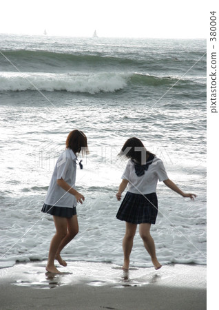 Two high school girls playing with the wave Two high school girls playing with the wave 380004