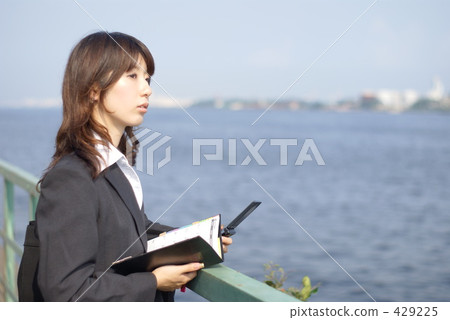 Business woman staring at the sea Business woman staring at the sea 429225