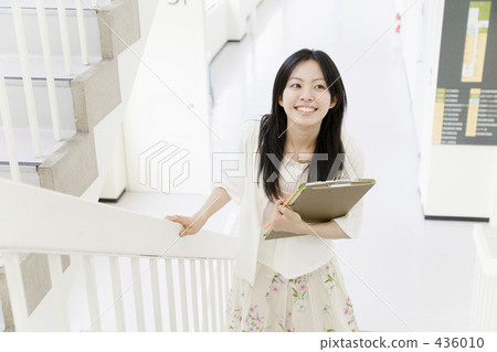 A woman ascending a staircase A woman ascending a staircase 436010