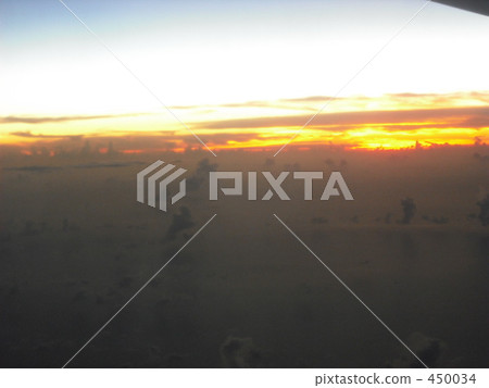A sunset from an airplane 450034