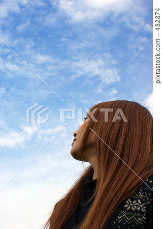 A girl looking up at the sky 482874