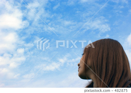 A girl looking up at the sky 482875