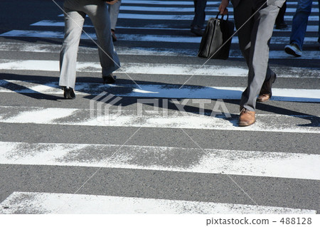 Businessman crossing a pedestrian crossing 2 488128