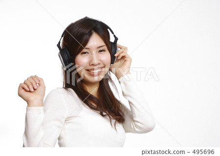 A woman listening to music 495696