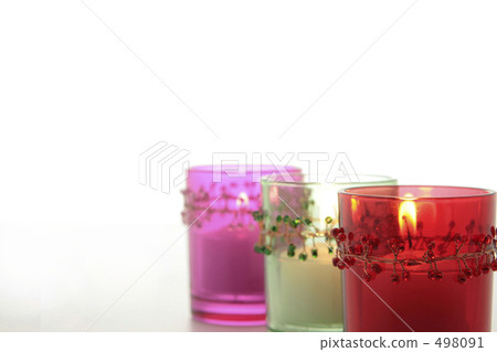 Three candles falling from the presence of beaded decorations 498091