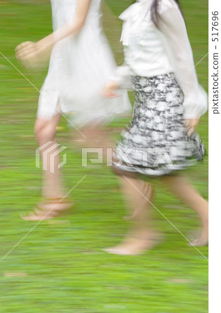 Two girls run by two people Two girls run by two people 517696