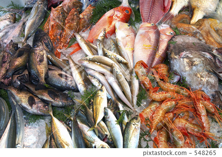 Fresh fish lined up at fishmonger storefront 548265