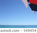 Sea, blue sky and umbrella 549454
