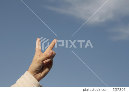 V sign in blue sky V sign in blue sky 557295