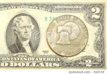 1 dollar coin and 2 dollar bill 560159