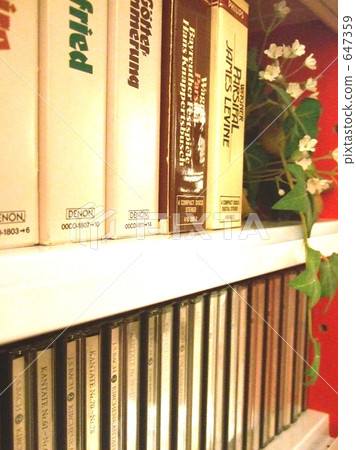 CD rack on which plants are sitting 647359