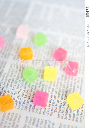 Square candy and English newspaper Square candy and English newspaper 654724