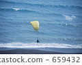 Hang rider flying beachfront 659432