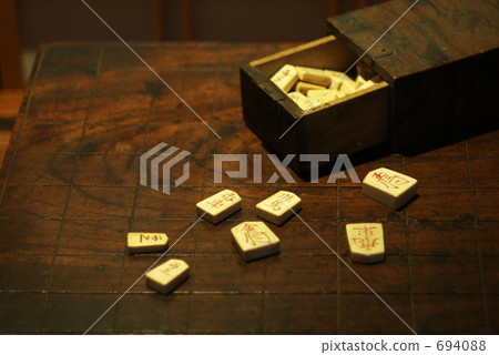 Old shogi board and pieces Old shogi board and pieces 694088