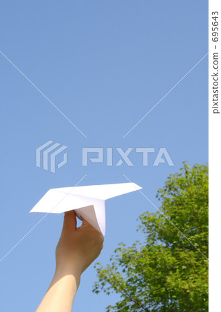 Women with paper airplane and fresh green 695643