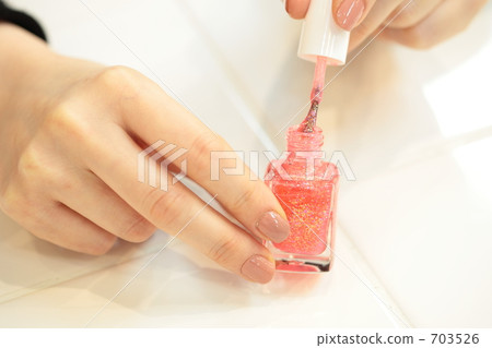 Nail bottle and female hands 703526