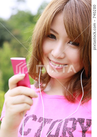 A woman listening to music 740280