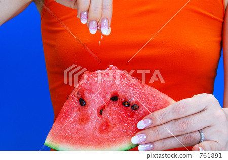 A woman saltling watermelon A woman saltling watermelon 761891
