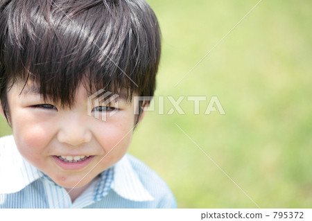 A 3 year old boy with a smile 795372