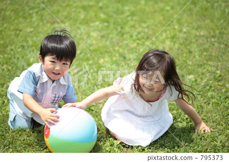 Young brother playing ball Young brother playing ball 795373